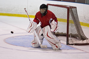 ice hockey goalie making a save